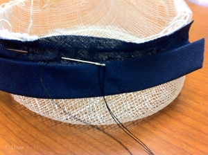 Hand-sewing binding on sinamay - this is the same technique used.